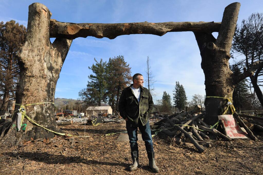 Houston Evans Jr., in front of his childhood home off Dennis Lane, Friday Dec. 29, 2017 where his mother, Valerie Evans, perished in the Tubbs fire in October. (Kent Porter / The Press Democrat) 2017