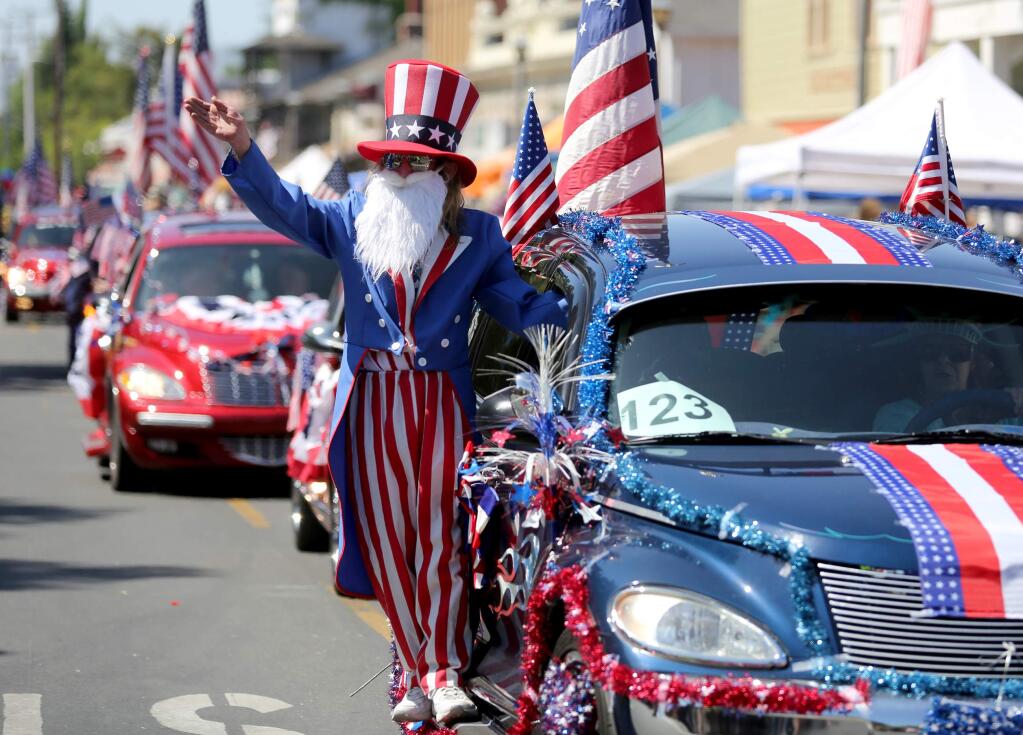 Johnny Sutton waves to the crowd during the Fourth of July Parade and Plaza celebration in Sonoma, July 4, 2012. (PD FILE)