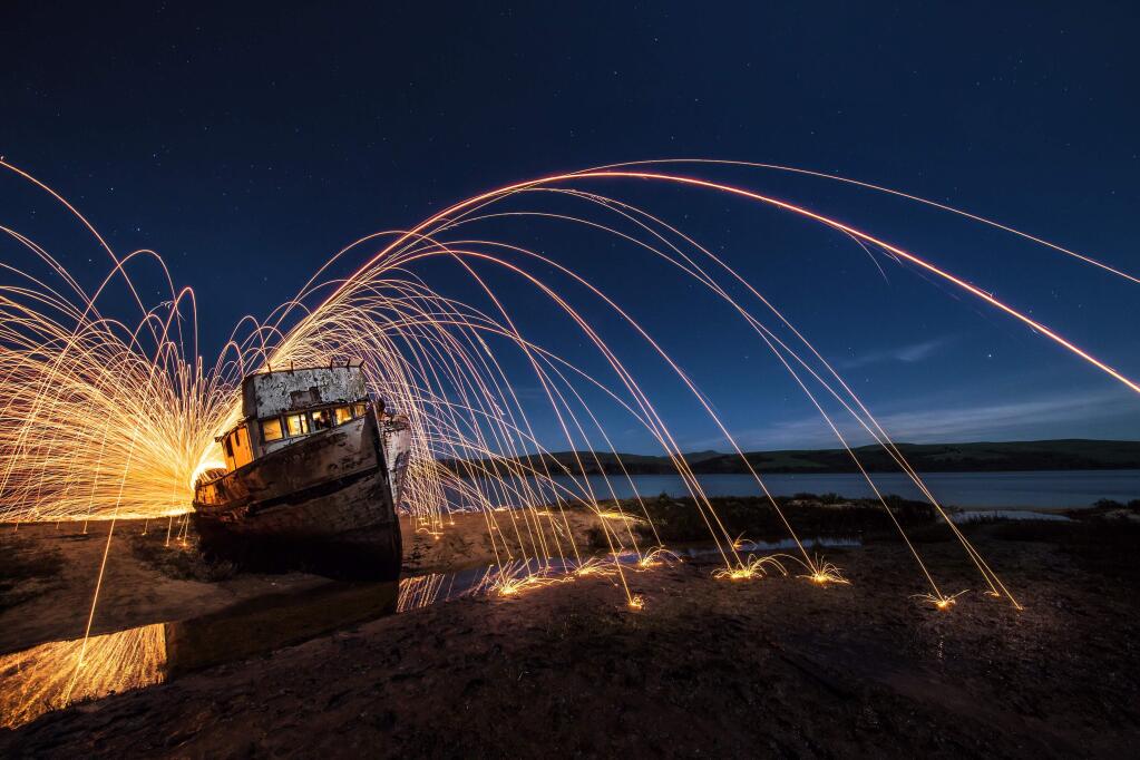 Photographer James Stewart has been the subject of social media backlash since posting this photo of someone burning steel wool at an iconic shipwreck in west Marin County over the weekend. A day after the photo was posted to Instagram, the boat was severely damaged by a fire that may have been sparked by whoever burned the steel wool. (Photo courtesy of James Stewart)