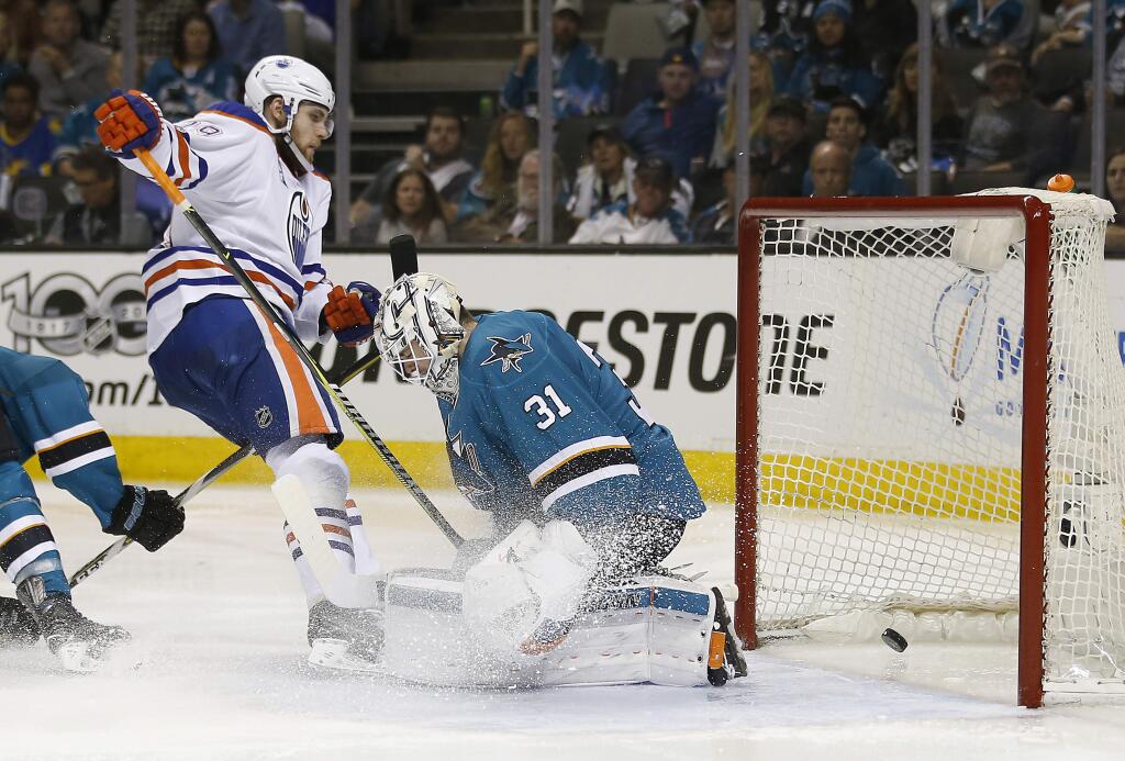 Edmonton Oilers center Leon Draisaitl (29) scores a goal past San Jose Sharks goalie Martin Jones (31) during the second period in Game 6 of the NHL hockey playoffs Saturday, April 22, 2017, in San Jose. (AP Photo/Tony Avelar)