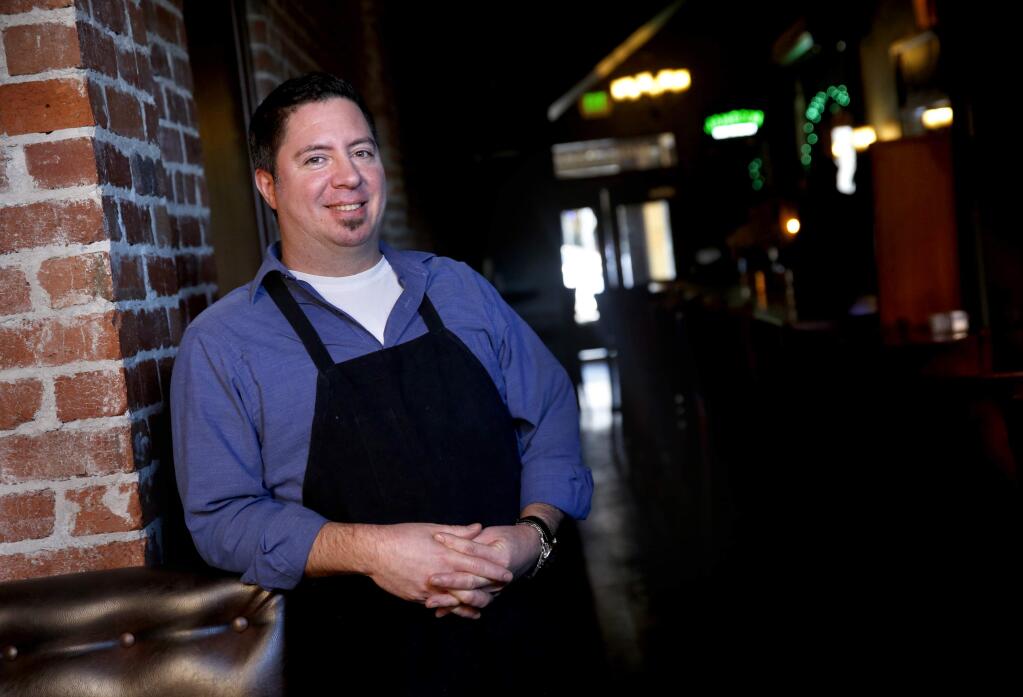 Jack Mitchell, owner of Jack and Tony's restaurant and whisky bar, will be giving away a free homemade ginger beer to all designated drivers on New Year's Eve. Photo taken in Santa Rosa, California on Tuesday, December 30, 2014. (BETH SCHLANKER/ The Press Democrat)