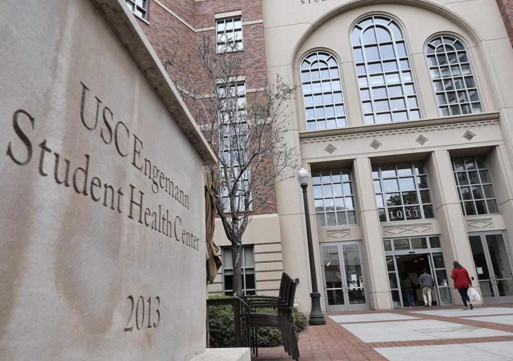 FILE - This Tuesday, May 22, 2018 file photo shows the University of Southern California's Engemann Student Health Center in Los Angeles. Detectives were trying to determine whether nude photographs linked to former USC gynecologist Dr. George Tyndall show any of the hundreds of women who allege he sexually harassed them during examinations. The collection found in a self-storage unit rented by Tyndall appeared to include homemade pornography, some of it decades old, but also photos of unclothed women in what appeared to be a medical exam room, police said. (AP Photo/Richard Vogel, File)