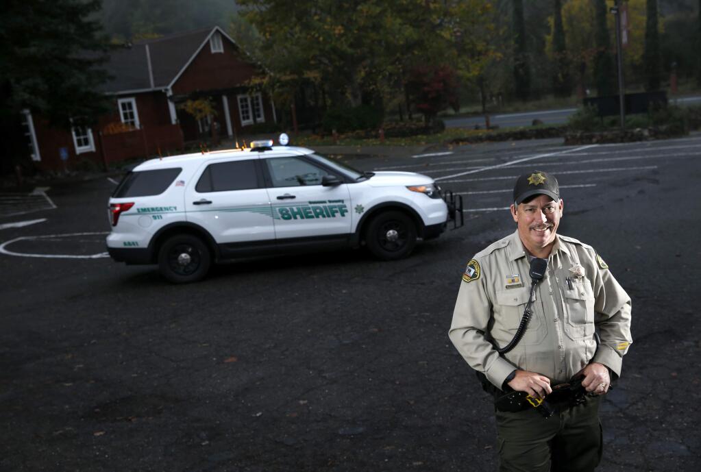 Mark Aldridge, a deputy with the Sonoma County Sheriff's Office, in the parking lot at Mark West Lodge Event Center in Santa Rosa, on Tuesday, November 14, 2017. (BETH SCHLANKER/ The Press Democrat)