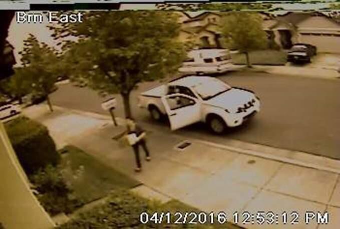 The surveillance camera of a homeowner at Barndance Lane in Santa Rosa captured an image of a suspected package thief and an associated vehicle, Tuesday, April 12, 2016. (SANTA ROSA POLICE DEPT.)