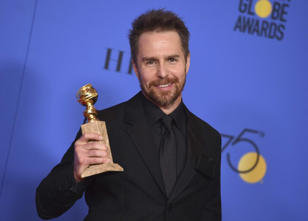 FILE- In this Jan. 7, 2018, file photo, Sam Rockwell poses in the press room with the award for best performance by an actor in a supporting role in any motion picture for 'Three Billboards Outside Ebbing, Missouri' at the 75th annual Golden Globe Awards at the Beverly Hilton Hotel in Beverly Hills, Calif. On 'Saturday Night Live,' guest host Rockwell let an expletive slip during a skit on Saturday, Jan. 13, 2018. He then put his hand to his mouth and said 'sorry' before continuing with the skit. (Photo by Jordan Strauss/Invision/AP, File)
