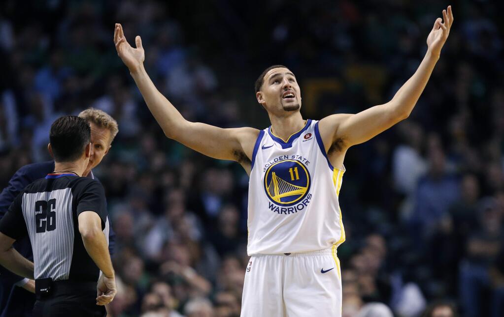 The Golden State Warriors' Klay Thompson protests a call during the fourth quarter against the Boston Celtics in Boston, Thursday, Nov. 16, 2017. The Celtics won 92-88. (AP Photo/Michael Dwyer)