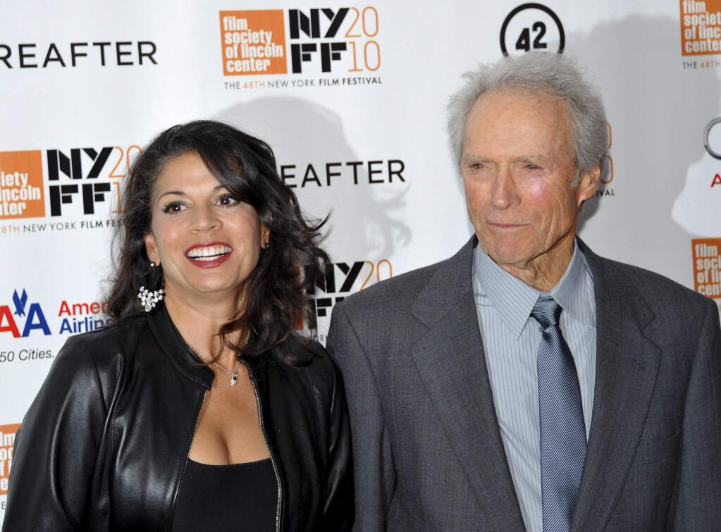 FILE - In this Oct. 10, 2010 file photo, director and producer Clint Eastwood, right, and wife Dina Marie Eastwood attend the premiere of 'Hereafter' at Alice Tully Hall during the 48th New York Film Festival, in New York. A Monterey County Superior Court judge finalized the couple's divorce after 18 years of marriage on Tuesday, Dec. 23, 2014. (AP Photo/Evan Agostini, File)