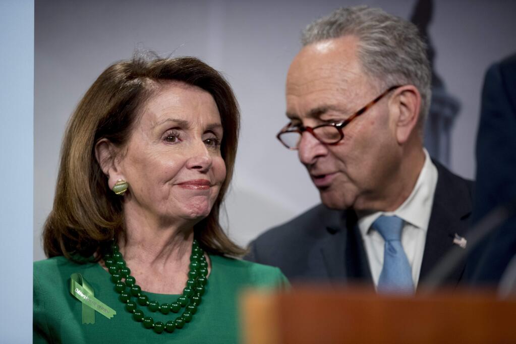 Senate Minority Leader Sen. Chuck Schumer of N.Y., right, and House Minority Leader Nancy Pelosi of Calif., left, speak together during a news conference on Capitol Hill in Washington, Wednesday, May 16, 2018, after the Senate passes a resolution to reverse the FCC decision to end net neutrality. (AP Photo/Andrew Harnik)
