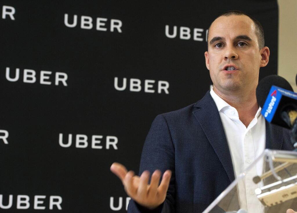 Jean-Nicolas Guillemette, Uber Quebec's general manager, speaks at a news conference in Montreal, Tuesday, Sept. 26, 2017. Ride-hailing company Uber says it will cease operating in Quebec on Oct. 14, if the province doesn't rescind new rules introduced last week. (Ryan Remiorz/The Canadian Press via AP)