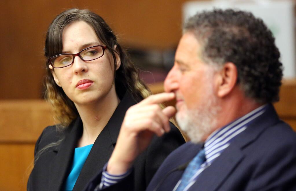Heather Howell wipes away a tear as she appears in Sonoma County Superior Court with her defense attorney Steve Spiegelman, in Santa Rosa, on Thursday, September 12, 2013.. A jury deadlocked on second degree murder charges, and found her guilty on charges of reckless driving and gross vehicular manslaughter while intoxicated. (Christopher Chung/ The Press Democrat)