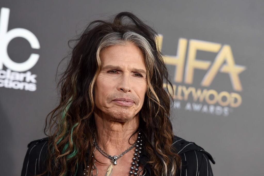 FILE - In this Friday, Nov. 14, 2014, file photo, Steven Tyler arrives at the Hollywood Film Awards at the Palladium, in Los Angeles. Aerosmith frontman Tyler is asking Republican presidential candidate Donald Trump to stop using the power ballad 'Dream On' at campaign events. (Photo by Jordan Strauss/Invision/AP, File)