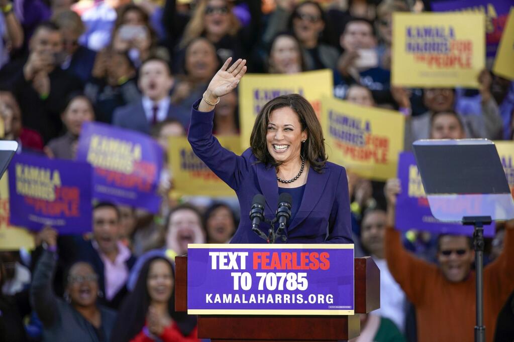 Democratic Sen. Kamala Harris, of California, waves to the crowd as she formally launches her presidential campaign at a rally in her hometown of Oakland, Calif., Sunday, Jan. 27, 2019. (AP Photo/Tony Avelar)