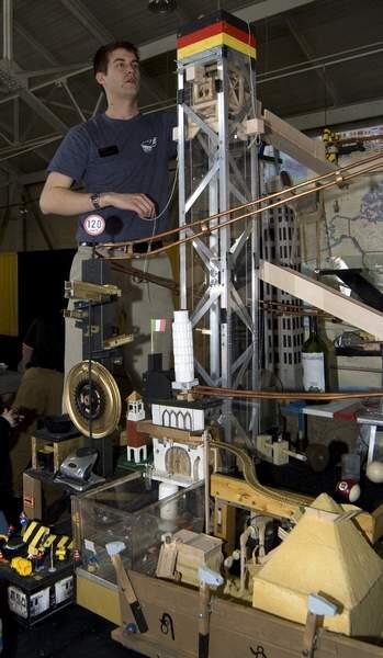 In this photo released by the Purdue News Service, Drew Wischer of the Purdue Society of Professional Engineers resets his team's machine between rounds of the national Rube Goldberg Machine Contest on Saturday, April 5, 2008 at Purdue University in West Lafayette, Ind. The Purdue team reclaimed the national title after finishing second in the 2007 event. (AP Photo/Purdue News Service,Vince Walter) ** NO SALES**