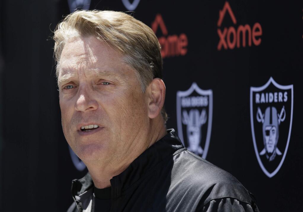 FILE - In this June 14, 2016, file photo, Oakland Raiders head coach Jack Del Rio answers questions during their football minicamp in Alameda, Calif. After 13 straight seasons without winning record or playoff berth, the Raiders enter 2016 with legitimate hopes of contending in AFC West. With Carr possibly ready to emerge as op-level quarterback in Year 3 as starter, game-breaking receiver in Cooper, and improved defense, coach Jack Del Rio has Oakland's most complete squad since team won AFC championship in 2002. (AP Photo/Eric Risberg, File)