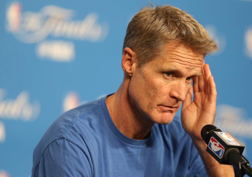 Golden State Warriors head coach Steve Kerr fields questions from the media in Cleveland on Thursday, June 9, 2016. (Christopher Chung / The Press Democrat)