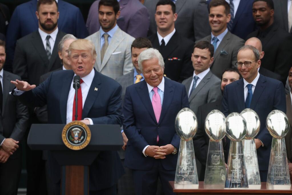 New England Patriots owner Robert Kraft, center, and others, listen as President Donald Trump speaks during a ceremony on the South Lawn of the White House in Washington, Wednesday, April 19, 2017, where the president honored the Super Bowl Champion New England Patriots for their Super Bowl LI victory. (AP Photo/Andrew Harnik)
