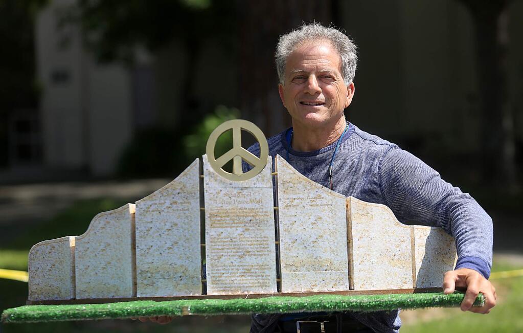Michael Gillotti with a model of his peace sculpture that he will construct across from the Sebastopol Plaza, Tuesday August 25, 2015. (Kent Porter / Press Democrat)