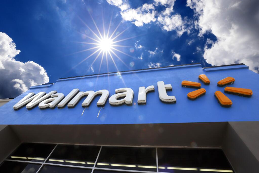 FILE - This June 25, 2019, file photo shows the entrance to a Walmart in Pittsburgh. (AP Photo/Gene J. Puskar, File)