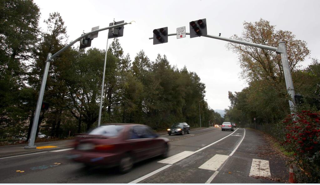 The city has installed a new kind of pedestrian signal on Montgomery Drive near Spring Lake Village in Santa Rosa, Tuesday, Dec. 9, 2014. (CRISTA JEREMIASON/ PD)