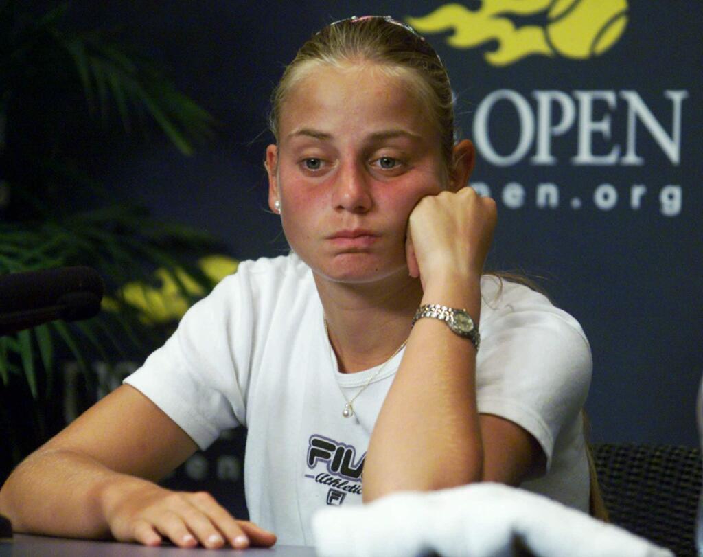 FILE - In this Aug. 31, 2000, file photo, Australia's Jelena Dokic reacts during a news conference at the U.S. Open tennis tournament in New York. Former Wimbledon semifinalist Jelena Dokic says her father physically, verbally and emotionally abused her from a young age when she started playing tennis. In an autobiography to be released this week, the 34-year-old Dokic says that Damir Dokic, who also was her coach, regularly beat her, pulled her hair and ears, kicked her and even spat in her face. (AP Photo/Ed Betz)