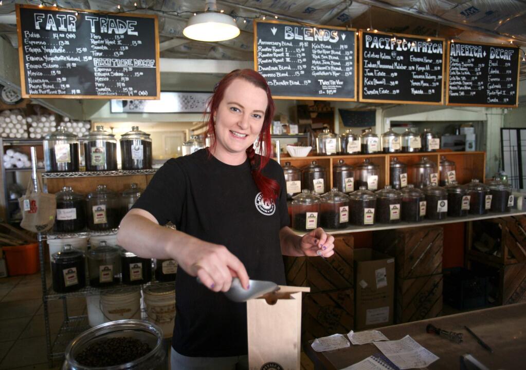 Service person of the week Jenny Long works three days a week at Petaluma Coffee and Tea and three days a week at Wishbone restaurant. Long is seen here weighing coffee for a customer on Tuesday March 3, 2015. (SCOTT MANCHESTER/ARGUS-COURIER STAFF)