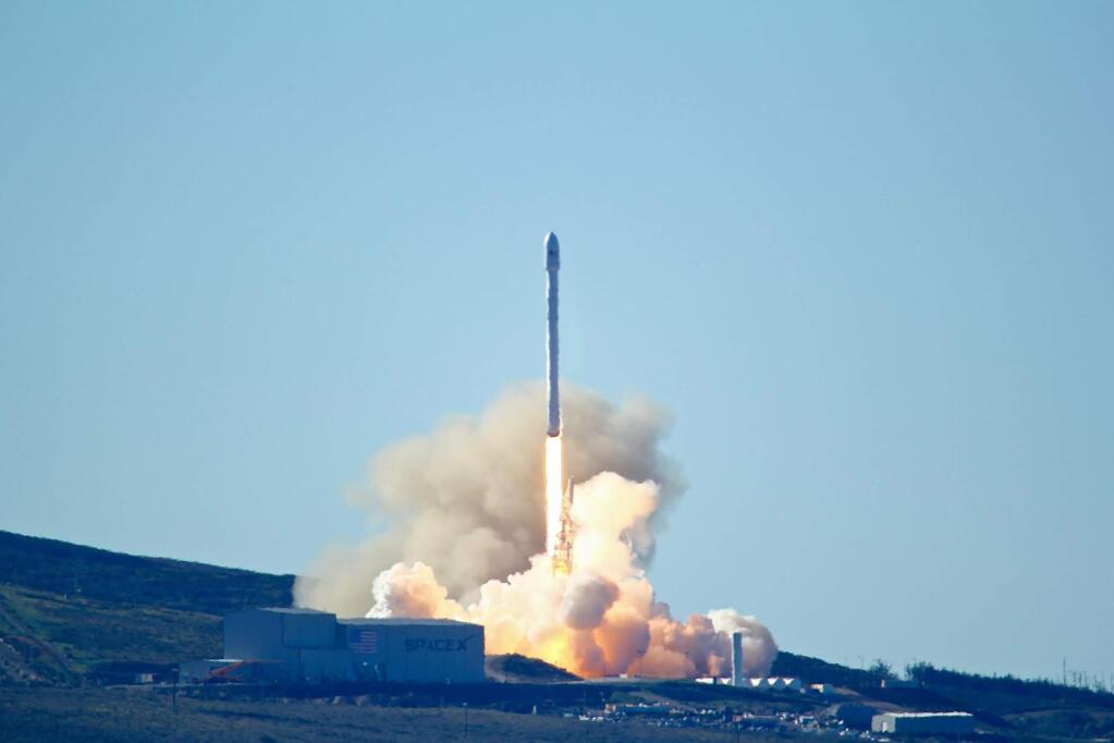 Space-X's Falcon 9 rocket with 10 satellites launches at Vandenberg Air Force Base, Calif. on Saturday, Jan. 14, 2017. The two-stage rocket lifted off to place 10 satellites into orbit for Iridium Communications Inc. About nine minutes later, the first stage returned to Earth and landed successfully on a barge in the Pacific Ocean south of Vandenberg. (Matt Hartman via AP)