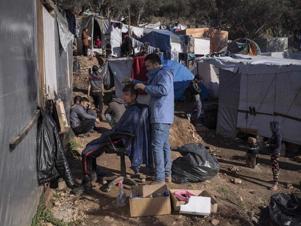 A sprawling tent city for migrants has spread into the olive groves and pine woods in Samos, Greece on Jan. 11, 2020. On Samos, the locals and asylum seekers bear the shared brunt of forces beyond their control, Greek government dysfunction, the cold shoulder of the European Union, the chaos in the Middle East and the geopolitical calculations of Turkey. (Laura Boushnak/The New York Times)