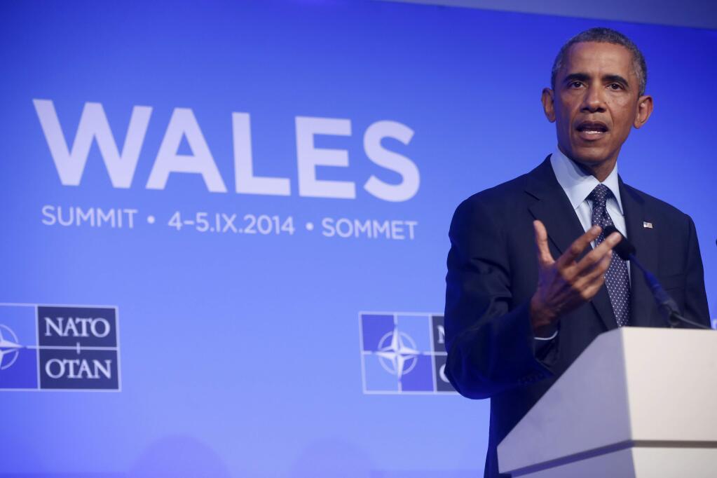 President Barack Obama speaks at a news conference at the NATO summit at Celtic Manor, Newport, Wales, Friday, Sept. 5, 2014. (AP Photo/Charles Dharapak)
