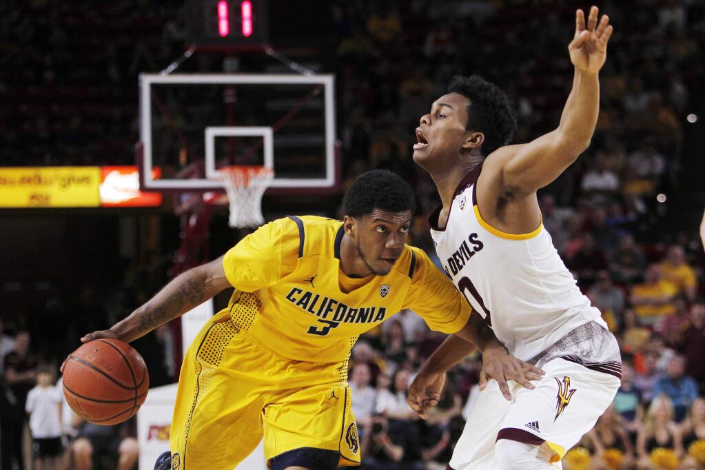 California guard Tyrone Wallace, left, dribbles the ball against Arizona State guard Tra Holder during the second half of an NCAA college basketball game in Tempe, Ariz., Saturday, March 5, 2016. California defeated Arizona State 68-65. (AP Photo/Ricardo Arduengo)