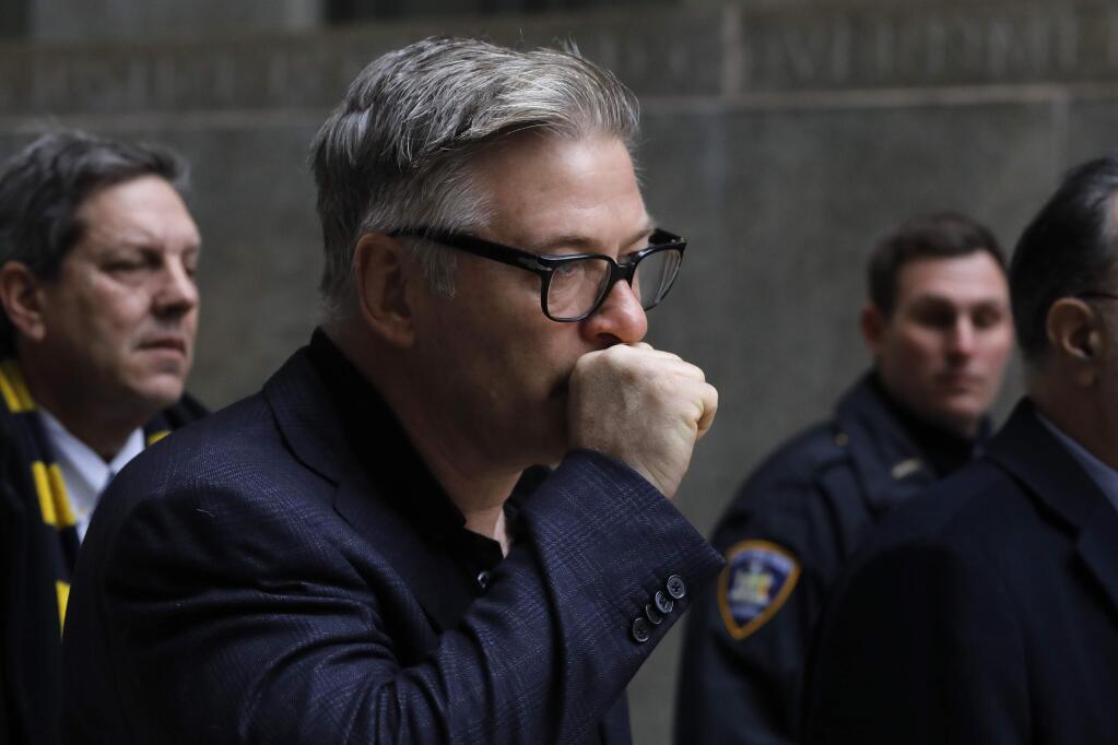 Actor Alec Baldwin leaves a New York City court, Wednesday, Jan. 23, 2019, after a hearing on charges that he slugged a man during a dispute over a parking spot last fall. (AP Photo/Mark Lennihan)