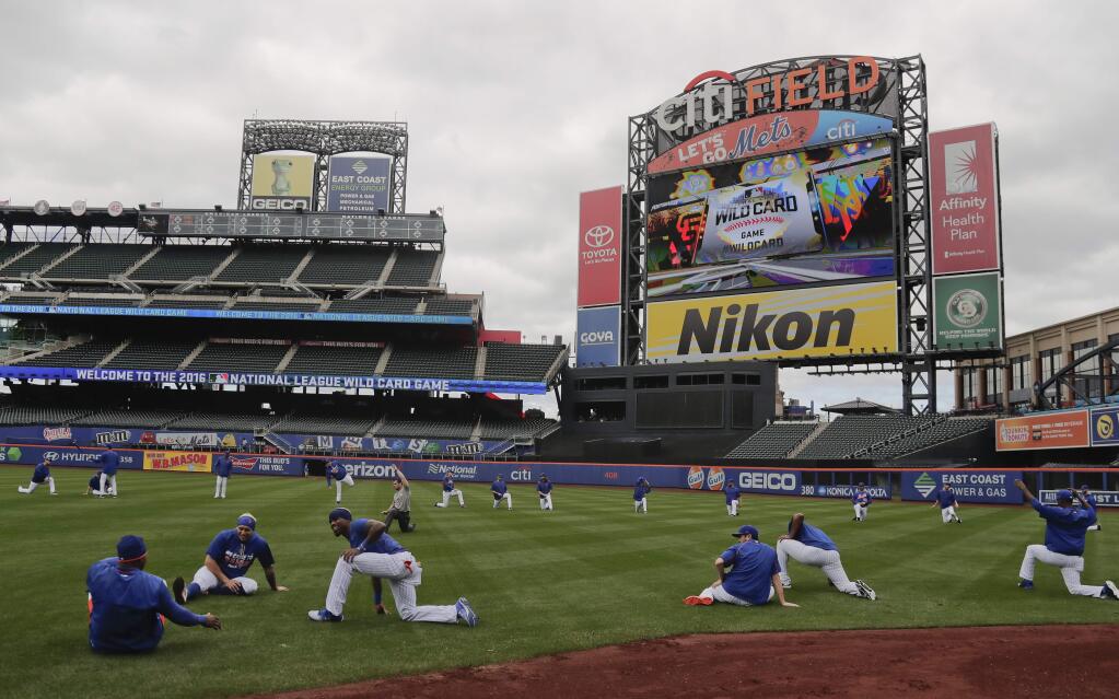 The New York Mets stretch during a team workout for the National League wild-card baseball game against the San Francisco Giants, Tuesday, Oct. 4, 2016, in New York. (AP Photo/Julie Jacobson)