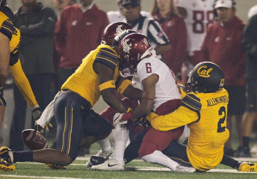 Washington State's Jamire Calvin (6) fumbles during the first quarter against Cal, Friday, Oct. 13, 2017, in Berkeley. Cal recovered the ball. (AP Photo/D. Ross Cameron)