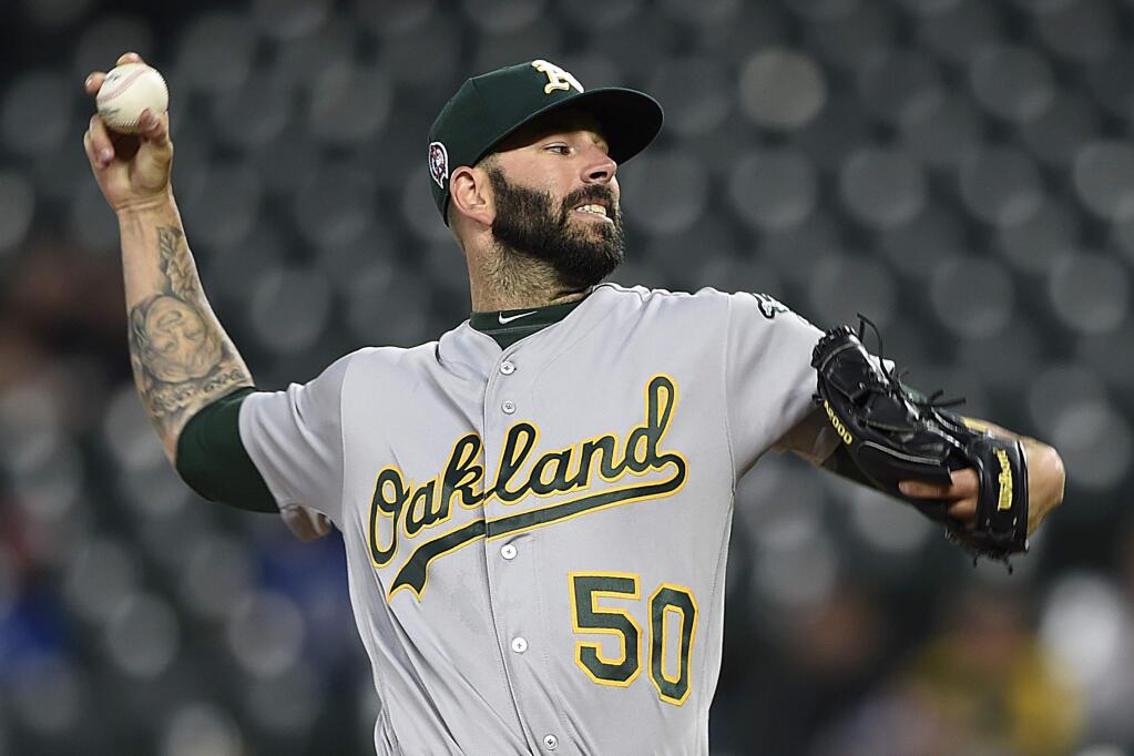 Oakland Athletics pitcher Mike Fiers throws against the Baltimore Orioles in the first inning Tuesday, Sept. 11, 2018, in Baltimore. (AP Photo/Gail Burton)