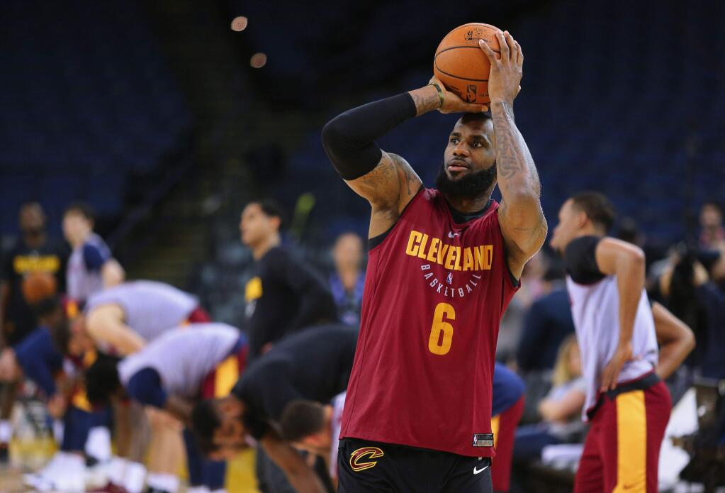 Cleveland Cavaliers forward LeBron James shoots the ball during practice, in Oakland on Wednesday, May 30, 2018. (Christopher Chung/ The Press Democrat)