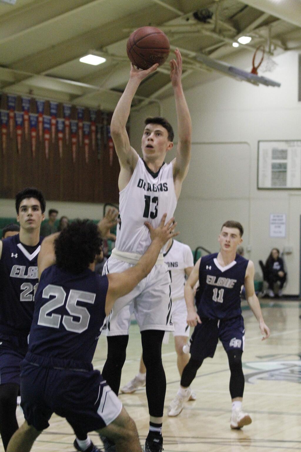 Jack Boydell shows the form that scored 28 points against Petaluma last week in this photo from an earlier game against Elsie Allen. (Bill Hoban/Index-Tribune)