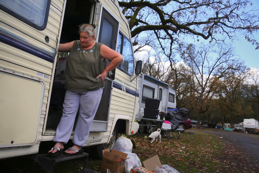 Cathy Green purchased a cheap RV to live in at the Hidden Valley Lake campground after her Anderson Springs home was destroyed in the Valley Fire. Now the campground is closing, and Green plans to move the RV to her Anderson Valley property, where she doesn't have water or electricity. (Christopher Chung/ The Press Democrat)