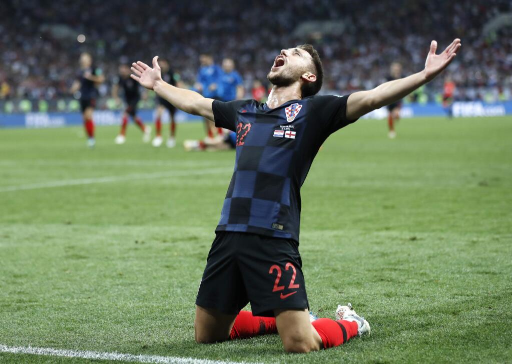 Croatia's Josip Pivaric celebrates after his team advanced to the final during the semifinal match between Croatia and England at the 2018 World Cup in the Luzhniki Stadium in Moscow, Russia, Wednesday, July 11, 2018. (AP Photo/Frank Augstein)