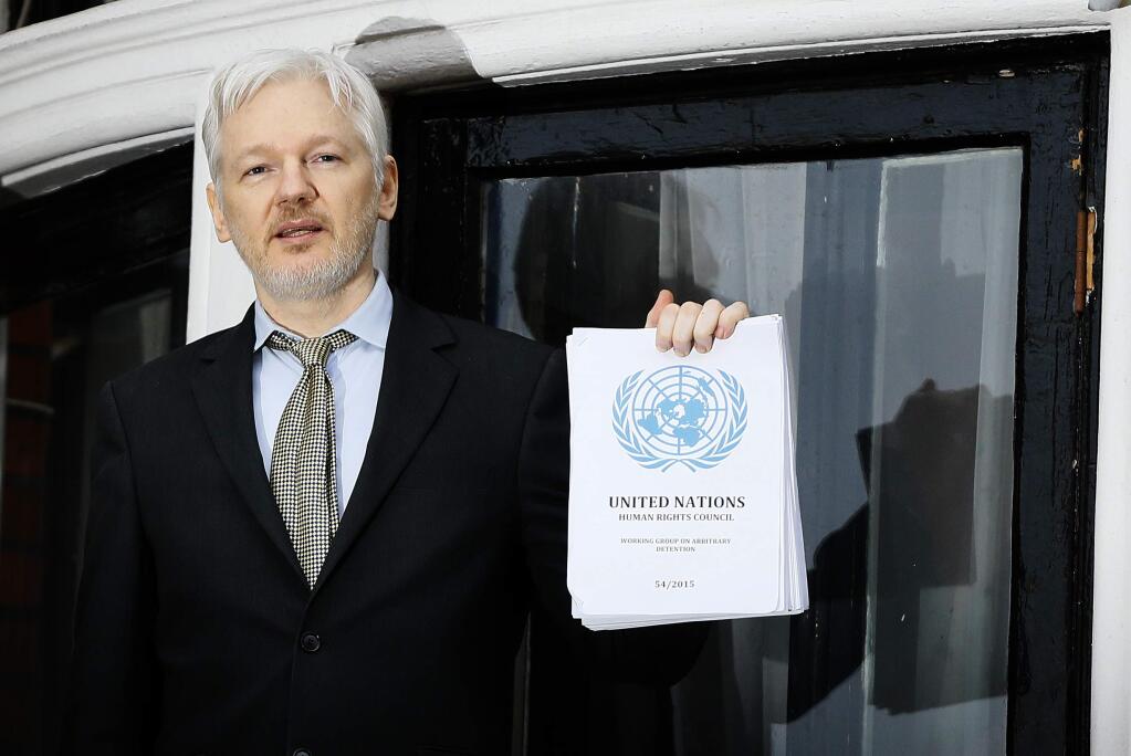 FILE - In this Feb. 5, 2016, file photo WikiLeaks founder Julian Assange speaks on the balcony of the Ecuadorean Embassy in London. President Barack Obama's decision to commute Chelsea Manning's sentence quickly brought fresh attention to another figure involved in the Army leaker's case: Julian Assange. In a tweet in early January 2017, Assange's anti-secrecy site WikiLeaks wrote, “If Obama grants Manning clemency Assange will agree to US extradition despite clear unconstitutionality of DoJ case.” (AP Photo/Kirsty Wigglesworth, File)