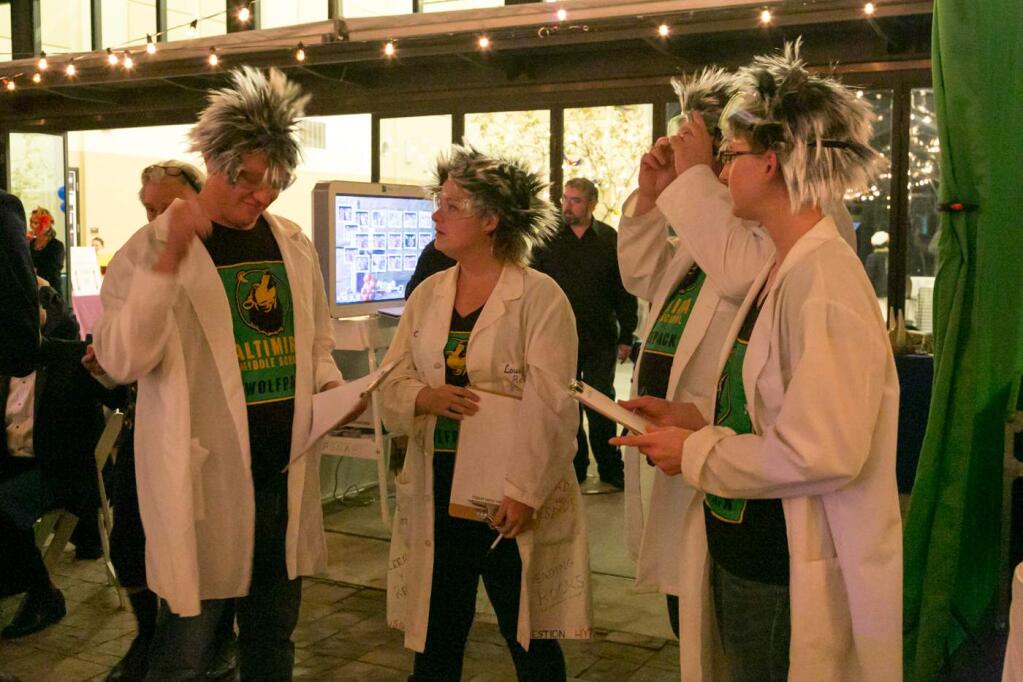 The mad scientists of Altimira Middle School prepare to make their laboratory pitch at the Rotary Club of Sonoma Valley's annual fundraider, 'Applause, Moonlight Masquerade' at the Hanna Boys Center, Saturday, Oct. 15, 2016. (Photo by Julie Vader/Special to the Index-Tribune)