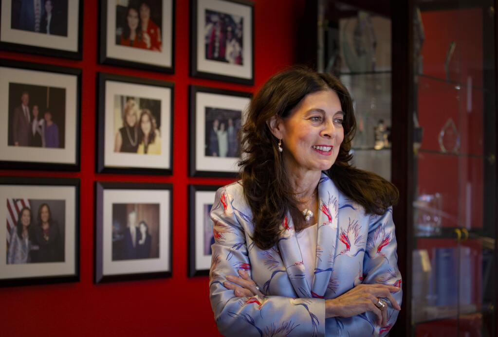 Petaluma, CA, USA._Tuesday, September 10, 2019._ Belinda Guadarrama, the president and CEO of Petaluma based GC Micro was recently named by Lockheed Martin as the 2019 Outstanding Small Business. Plastered on the walls of the office are photos of Belinda with presidents and dignitaries and behind her is one of two trophy cases filled with various honors through the years. (CRISSY PASCUAL/ARGUS-COURIER STAFF)