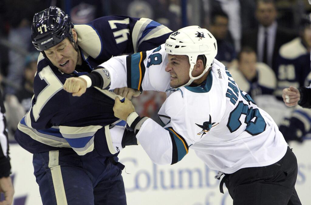 Columbus Blue Jackets' Dalton Prout, left, fights with San Jose Sharks' Michael Haley during the first period of an NHL hockey game Sunday, Nov. 22, 2015, in Columbus, Ohio. (AP Photo/Jay LaPrete)
