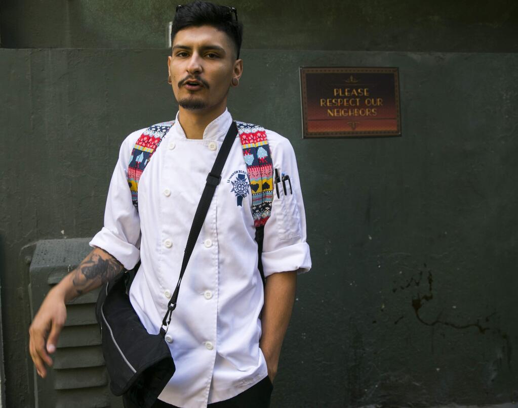 Andrew Rodriguez, 21, a student at Le Cordon Bleu College of Culinary Arts, comments on California's new age regulations for tobacco products in Los Angeles on Wednesday, June 8, 2016. 'I think it's better,' said the 21-year-old chef-in-training from Los Angeles. 'I just hope they don't raise the drinking age.' Smokers have to be 21 and older to buy tobacco products in California under a new law that takes effect on Thursday. (AP Photo/Damian Dovarganes)