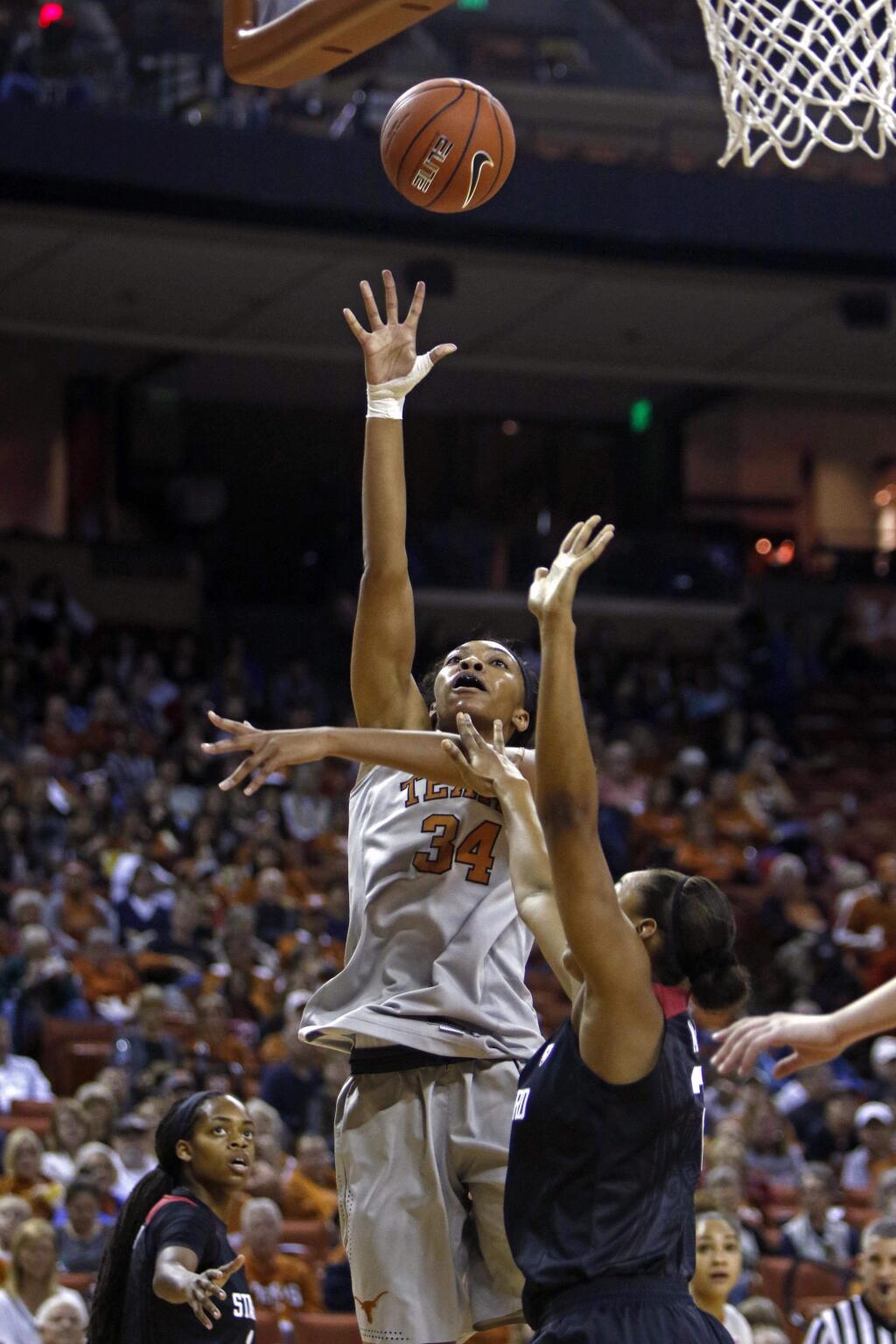Texas center Imani Boyette (34) shoots against Stanford forward Erica McCall during the first half of an NCAA college basketball game, Sunday, Dec. 13, 2015, in Austin, Texas. (AP Photo/Michael Thomas)
