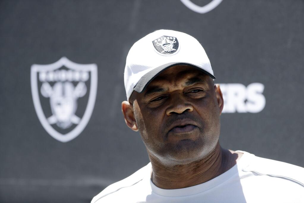 Oakland Raiders defensive coordinator Ken Norton Jr. fields questions after the team's organized team activity at its NFL football training facility Tuesday, June 6, 2017, in Alameda, Calif. (AP Photo/Marcio Jose Sanchez)