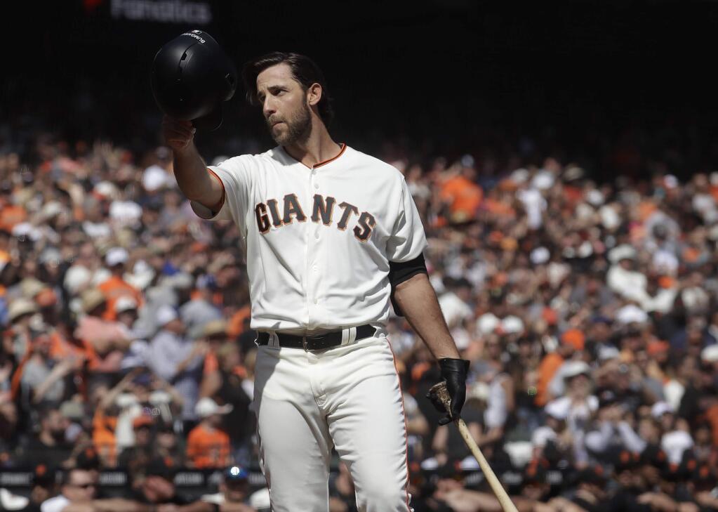 FILE - In this Sunday, Sept. 29, 2019, file photo, San Francisco Giants' Madison Bumgarner waves toward fans before pinch hitting against the Los Angeles Dodgers during the fifth inning of a baseball game in San Francisco. The Giants plan to meet with the free agent left-hander‚Äôs representatives during the December 2019 baseball winter meetings in San Diego. (AP Photo/Jeff Chiu, File)