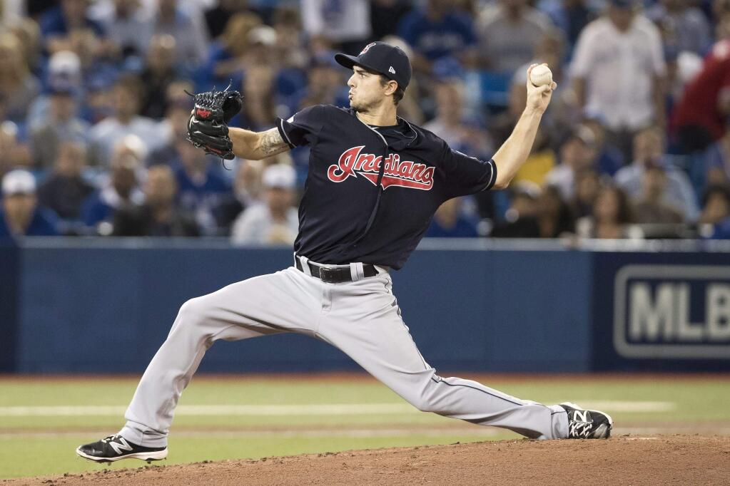 Cleveland Indians starting pitcher Ryan Merritt pitches against the Toronto Blue Jays during the first inning in Game 5 of baseball's American League Championship Series in Toronto, Wednesday, Oct. 19, 2016. (Mark Blinch/The Canadian Press via AP)