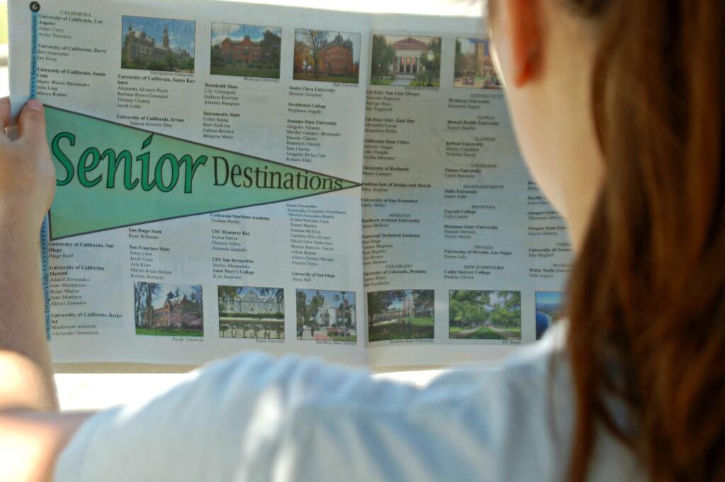 Lorna Sheridan/Index-TribuneMaddie Sashel looks over the senior destination page that published in the Dragon's Tale.