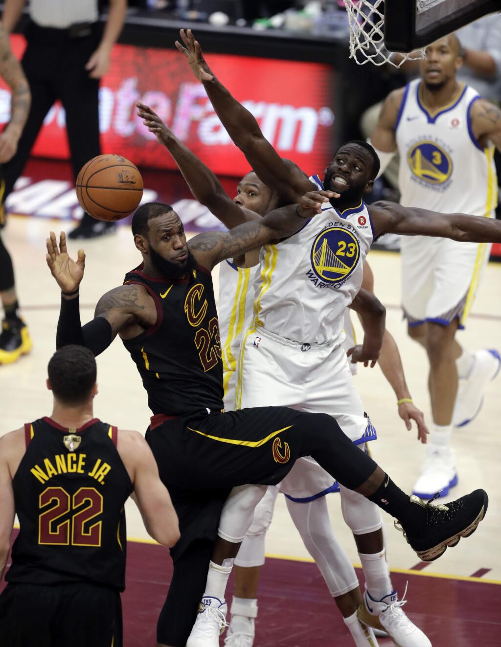 The Cleveland Cavaliers' LeBron James is defended by the Golden State Warriors' Draymond Green during the second half of Game 4 of the NBA Finals, Friday, June 8, 2018, in Cleveland. (AP Photo/Tony Dejak)