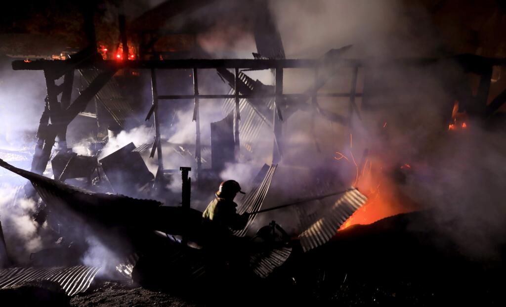 A fire at Occidental Arts and Ecology Center, gutted a large barn and vehicles, Wednesday, April 28, 2020 in Occidental. (Kent Porter / The Press Democrat) 2020