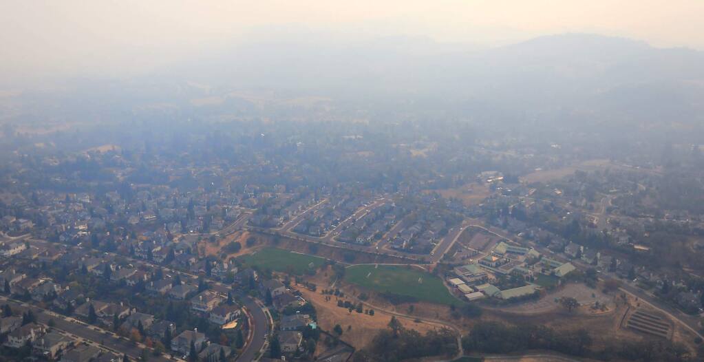 The Skyhawk community of Santa Rosa is enveloped in smoke from the raging Sonoma County fires, Wednesday, Oct. 11, 2017. (Kent Porter / Press Democrat) 2017